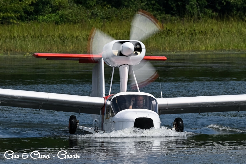 Pilot of the Schweizer TSC-1A2X arriving at the Orillia Fly-in/Splash-in and maneuvering on the water for photo ops.