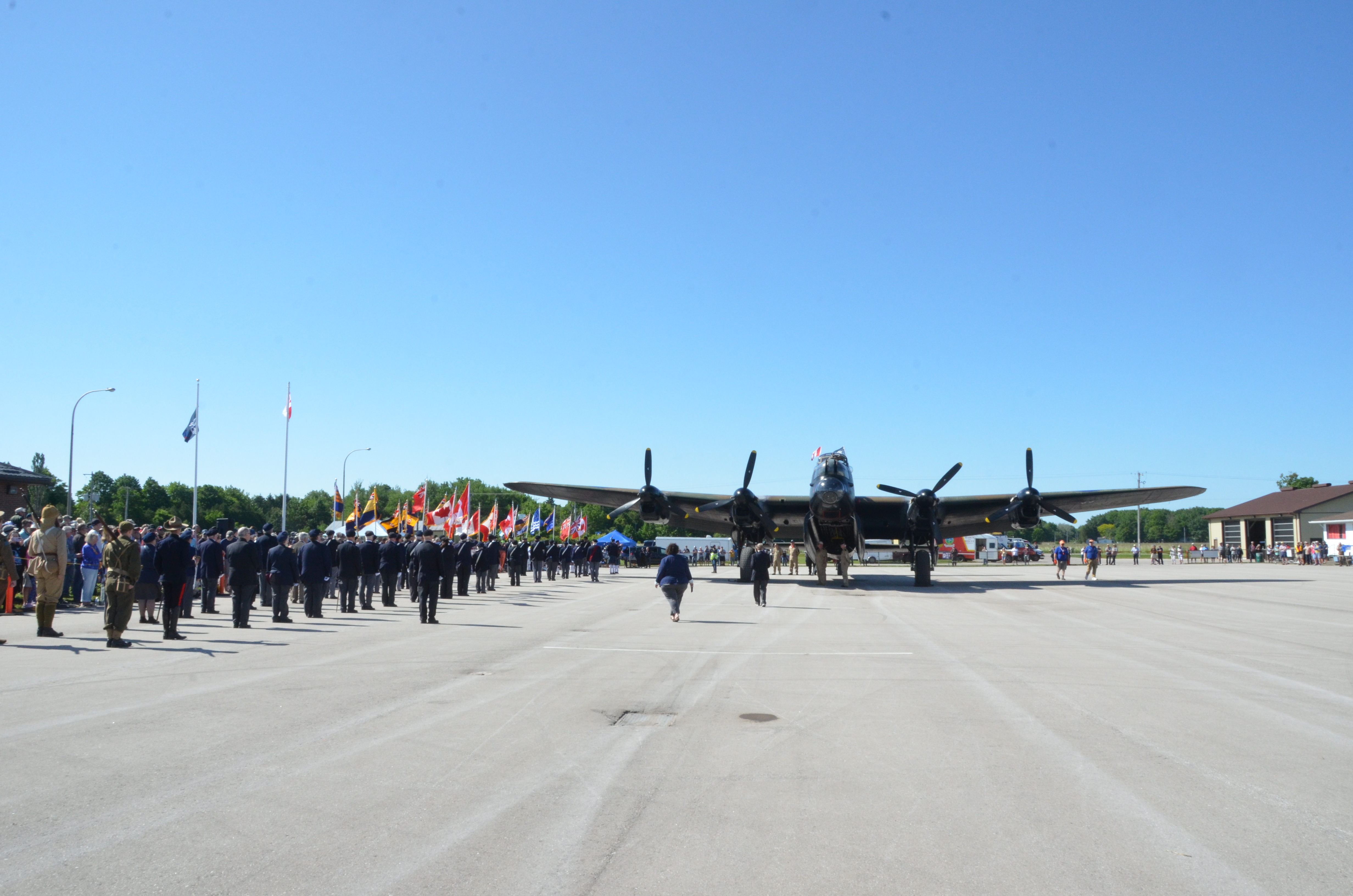The Lancaster parked on the main ramp at Goderich. Legion members and public awaiting the beginning of the speeches.